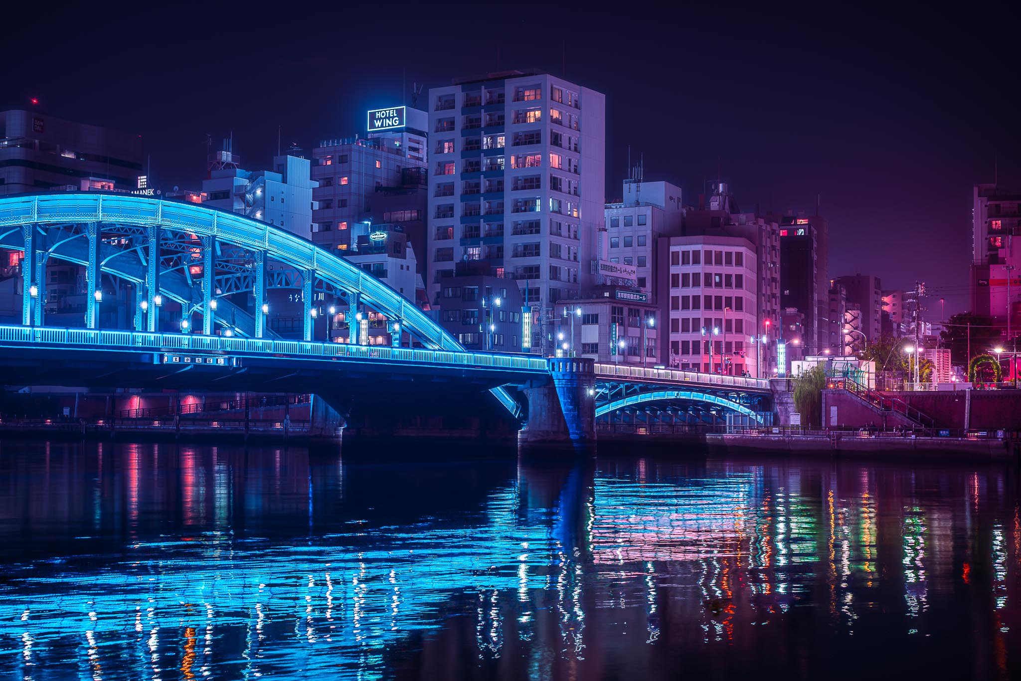 Asakusa Tokyo at night — Azuma bridge over Sumida River with blue reflections
