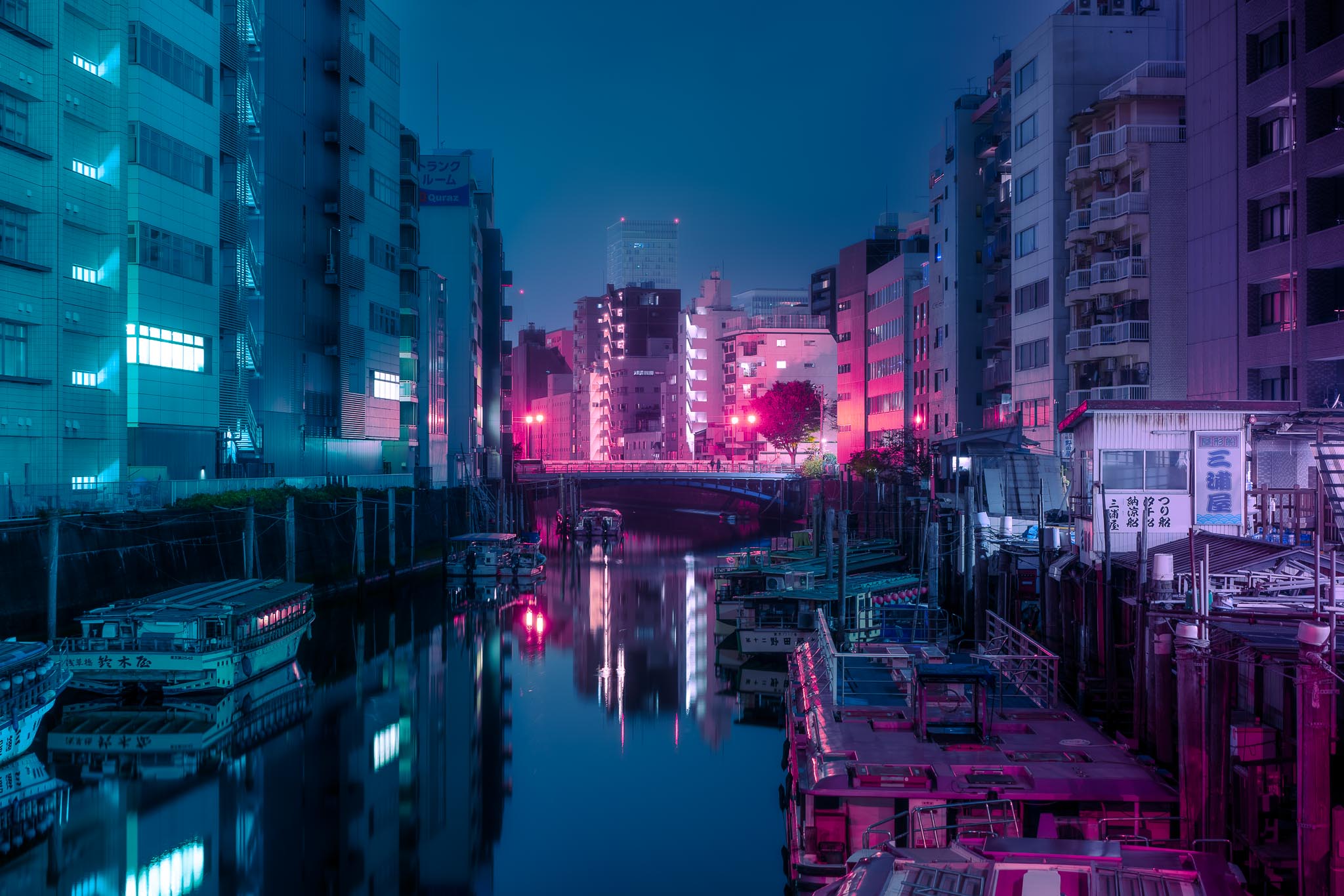 Asakusa canal at night — yakatabune boats and neon reflections Tokyo
