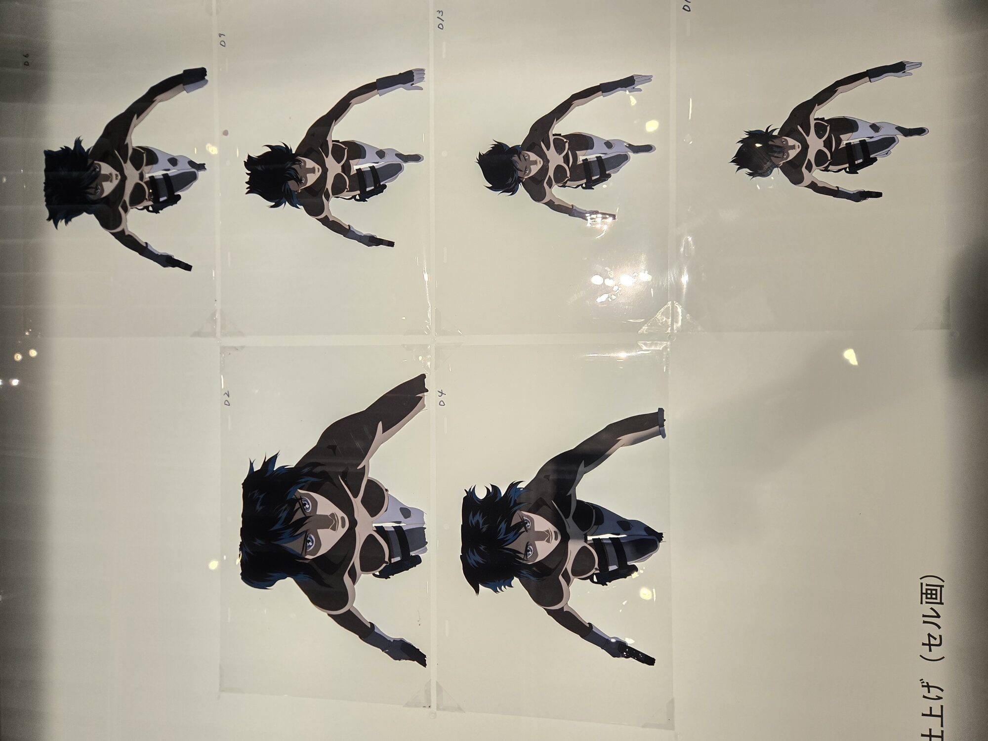 Original Ghost in the Shell animation cels — six sequential frames of Motoko Kusanagi in thermoptic suit, numbered pencil annotations