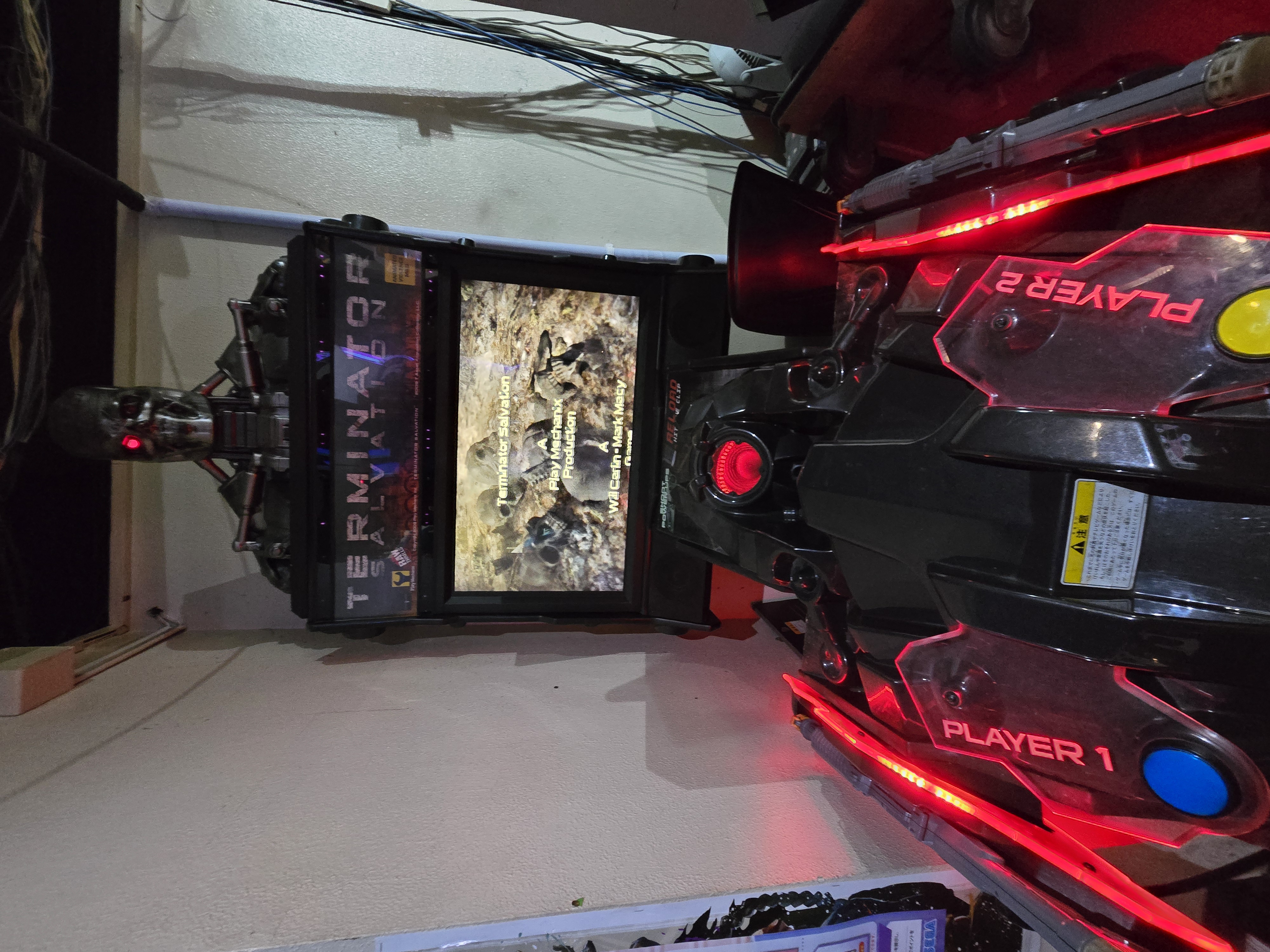 Terminator Salvation arcade cabinet with red LED lighting at Mikado Ikebukuro