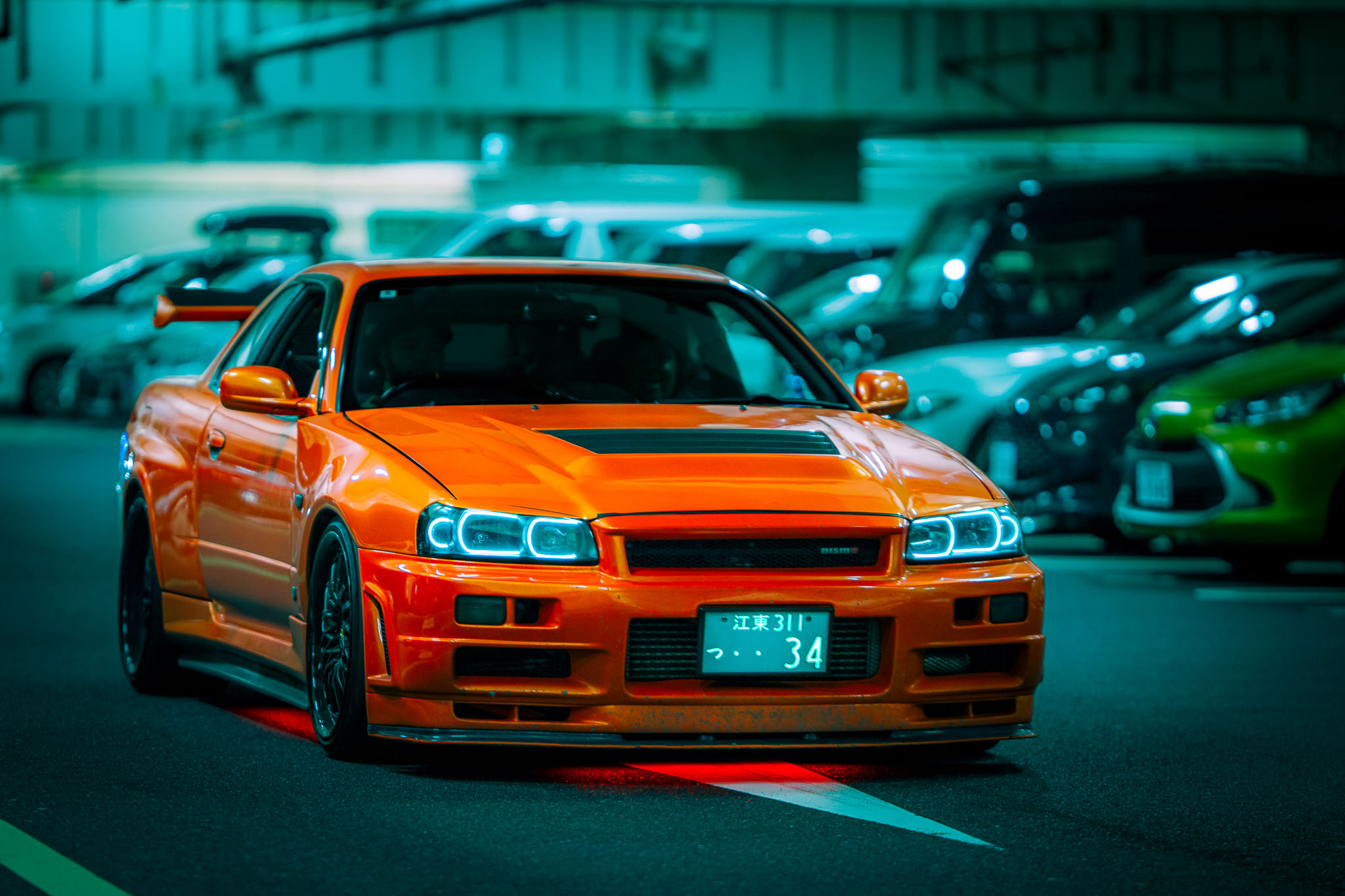Orange Nissan Skyline GT-R R34 NISMO at Umi Hotaru car meet — Tokyo Bay