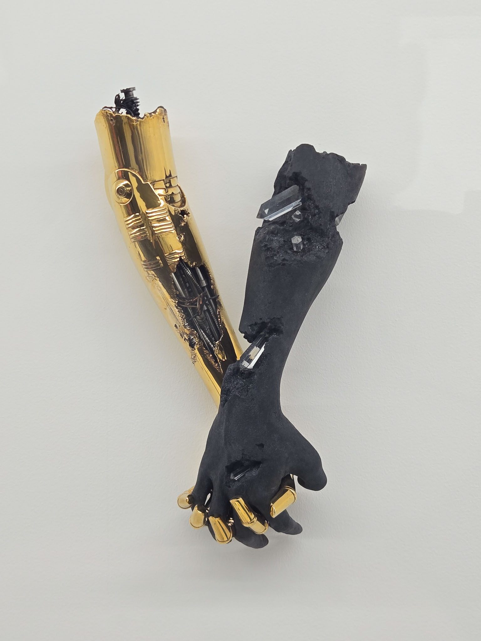 Sorayama gold and matte black robotic arm sculptures — exhibition Tokyo