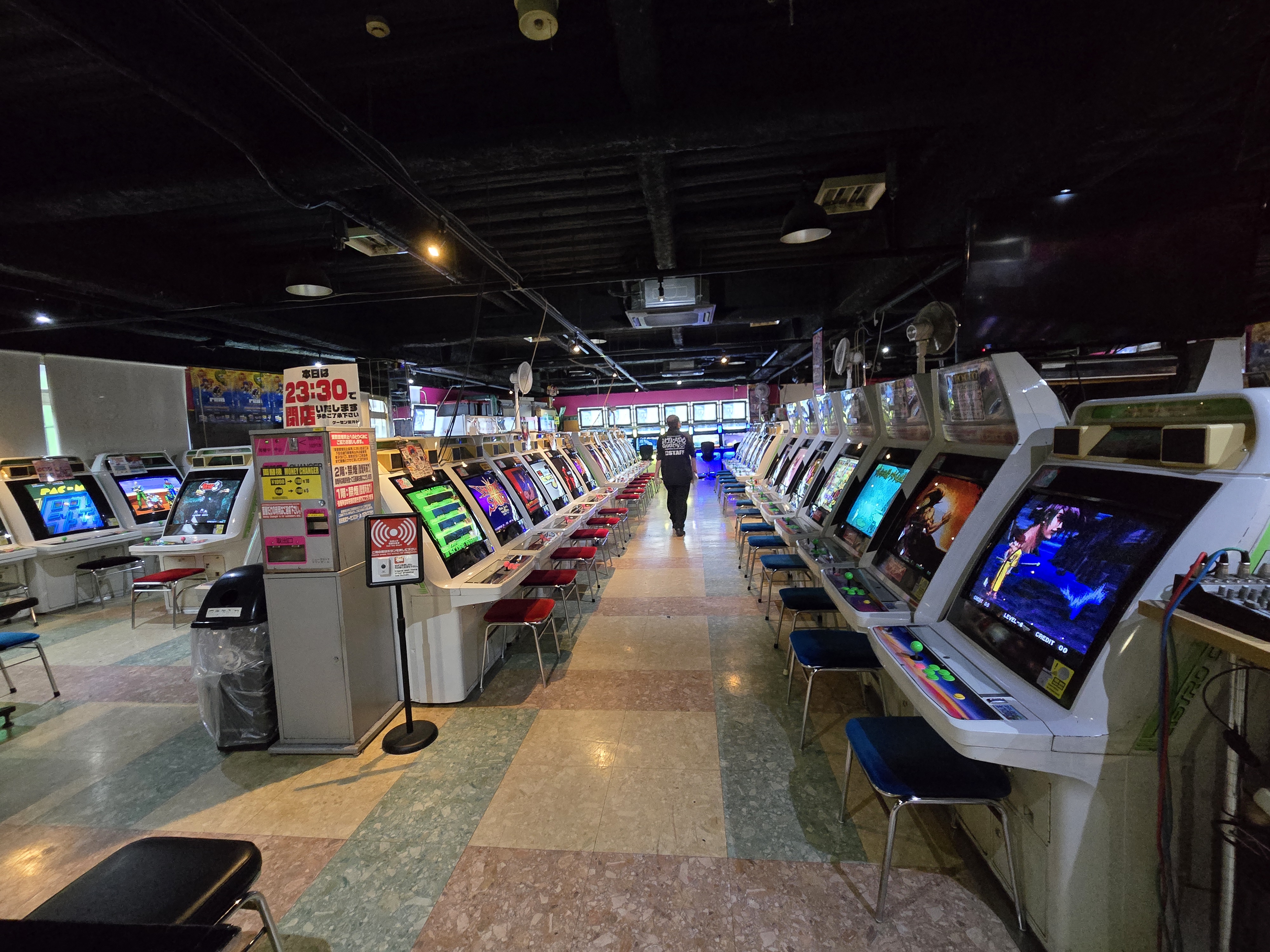Game Center Mikado Takadanobaba — main floor, rows of arcade cabinets, 23:30 closing sign