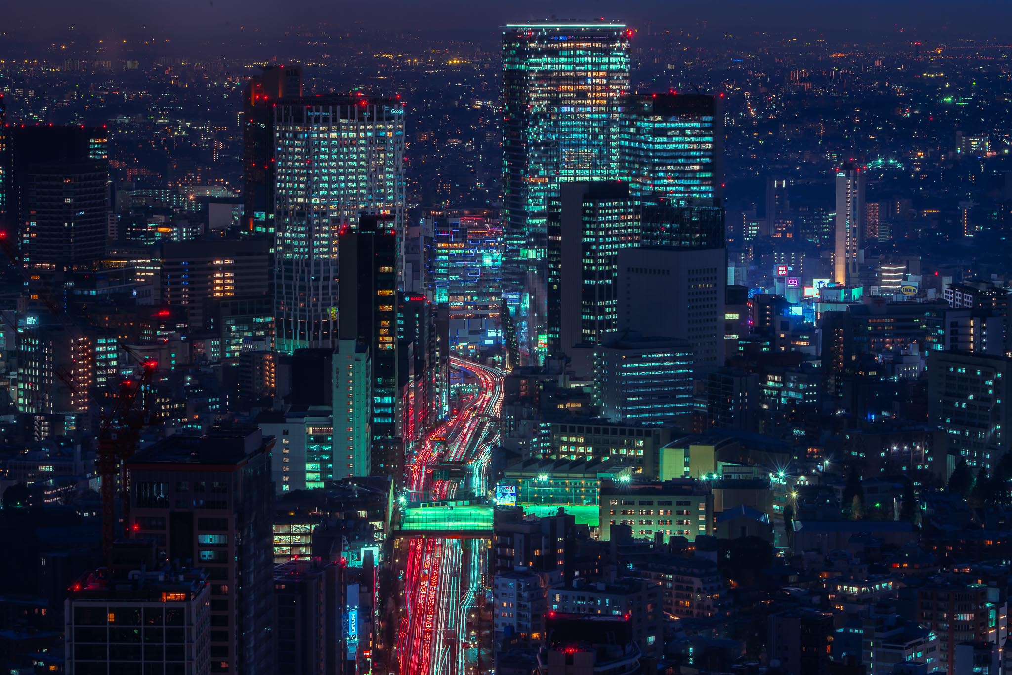 Tokyo at night from Mori Tower — city skyline with highway light trails